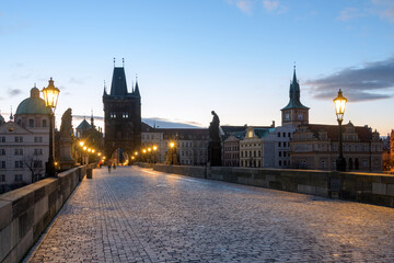 Fototapeta premium Sunrise at Charles Bridge in Prague with Historic Architecture