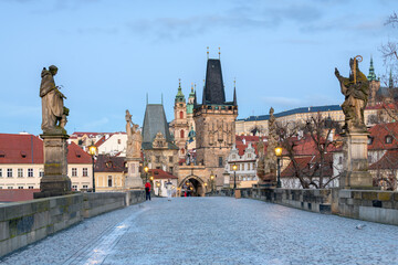 Fototapeta premium Sunrise at Charles Bridge in Prague with Historic Architecture