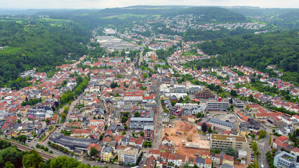 Fototapeta premium Aerial view around the city Merzig in Germany on a cloudy spring noon