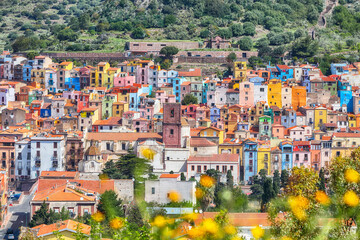 Obraz premium Remarkable morning panorama of colourful houses of old town Bosa in Sardinia.