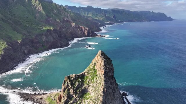 Flight over the Roque de Tierra cliff in the Atlantic Ocean with a view of the northern part of Tenerife. Canary Islands.