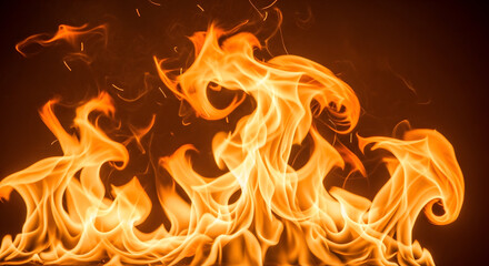 Fototapeta premium A vibrant and intense close up view of bright orange flames dancing against a dark background