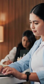 Typing, employee and woman with laptop in boardroom, paralegal and fact checking evidence on website. Law firm, legal assistant and person with tech for legislation update, online and case research