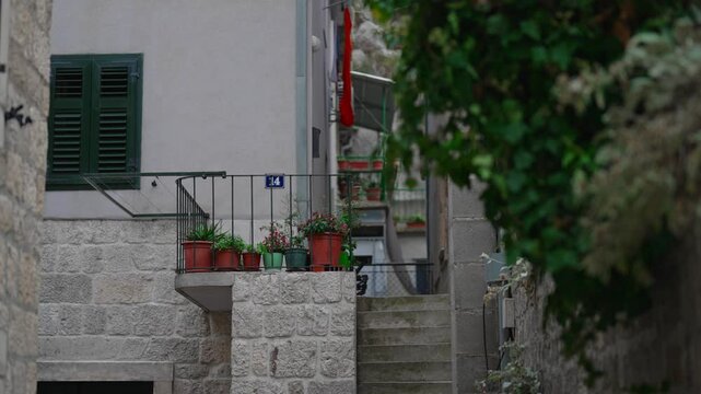 Narrow cobblestone street in a historic Mediterranean old town.
