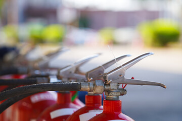 A red fire extinguisher is placed there, ready for use during basic fire fighting training.