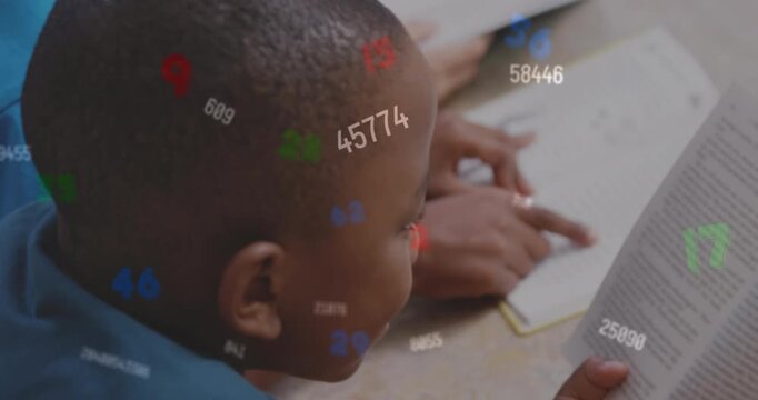 Animation of changing numbers and letters, overhead view of african american students reading book