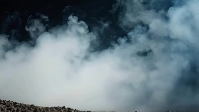 Billowing smoke over rocky terrain