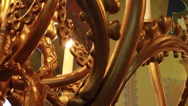 Cinematic reveal of majestic synagogue altar and Star of David past glowing candelabra
