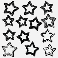 Obraz premium Hand-drawn black and white star doodles on white background