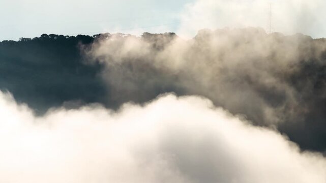 clouds floating over green mountain range