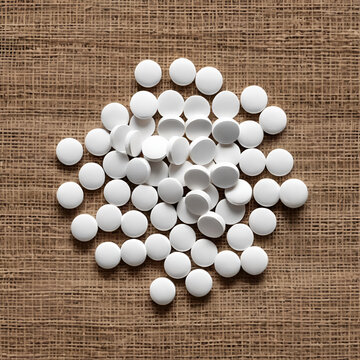 Tablets on a sackcloth background.Paracetamol, Antibiotics, Antihistamines, Amitriptyline, Hydrochloride, Vitamin B Complex.