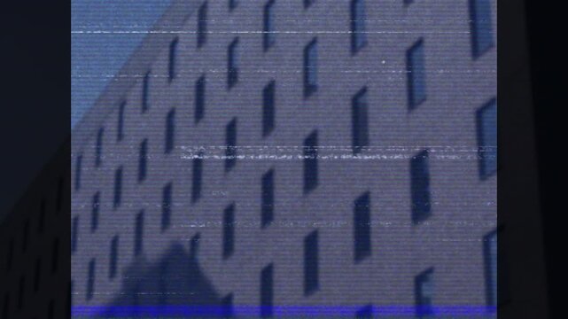 Animation of glitch effect against view of tall building