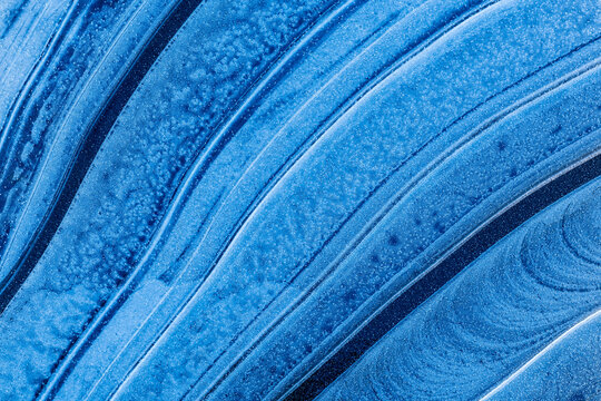 Ice patterns in frozen puddle, The New Forest, Hampshire, England, UK. November. 