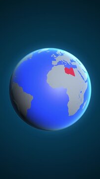 The animation shows a graphic representation of the earth and highlights the location and map of Libya colored red in vertical format.