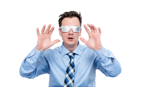 Shocked businessman wearing improvised foil glasses raising hands in fear or stop gesture, funny paranoia concept, conspiracy humor, isolated transparent background png, emotional reaction.