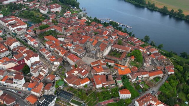  Aerial panoramic view beside the old town of  the city Tui in Spain on a cloudy summer noon.