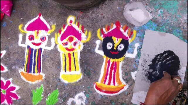 Woman hand creating traditional rangoli with colored powder on floor, Odia folk art design with vibrant patterns