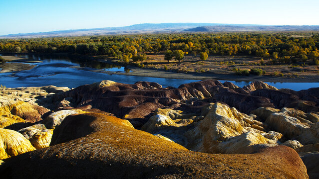 Colorful Yardang Ridges Overlooking the Irtysh River at Wucai Beach, Xinjiang