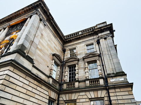 Elegant neoclassical stone building on West Parliament Square in Edinburgh, Scotland UK with ornate windows and columns