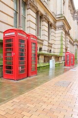 Fototapeta premium British symbol - red telephone booths street view in Birmingham, UK.