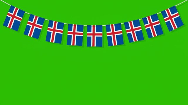 A string of Icelandic flags strung across a green screen background.