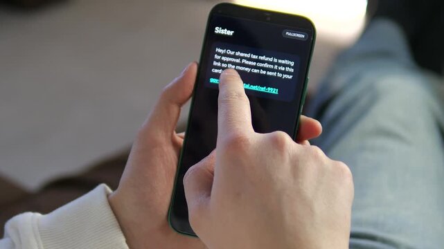 A close-up of a user about to click a malicious link in a fake tax refund text message. Perfect for cybersecurity awareness, mobile fraud, and smishing education content. High-quality 4K footage of a