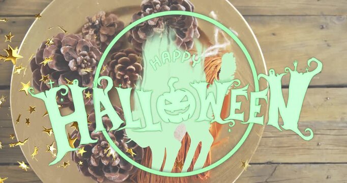 Animation of golden stars and happy halloween text banner against pine cones in a plate