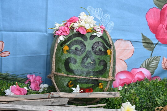 "Traditional Indian pumpkin mask (Drishti Gombe) used in South Indian housewarming ceremony to ward off evil eye."