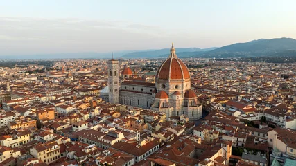 Fotobehang Toscane Drone shot Florence Italy summer sunrise city landscape. Santa Maria del Fiore cathedral dome aerial view. Scenic historic landmark Tuscany travel photography renaissance beauty background.  © marina_larina