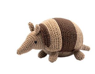 Obraz premium Handmade Crochet Armadillo Plush Toy Isolated on Black Background, Cute Knitted Animal Stuffed Toy for Kids and Home Decor