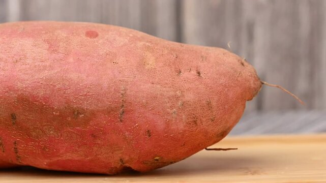 video of a raw sweet potato
