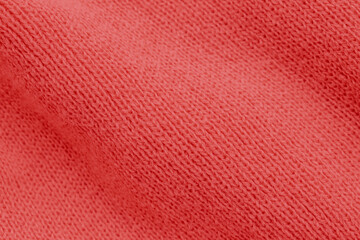 Vibrant red knit texture with a classic ribbed stitch pattern. Soft waves and deep crimson shadows create a warm, dynamic background perfect for festive or cozy themes