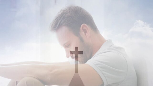 Praying, man with cross shadow overlaying arms and head in animation