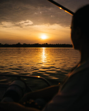 woman on boat at sunset on zambezi river