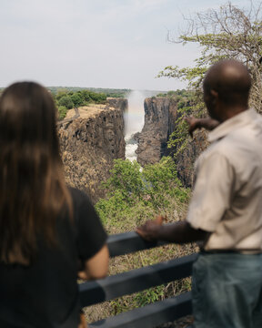 woman exploring victoria falls with guide