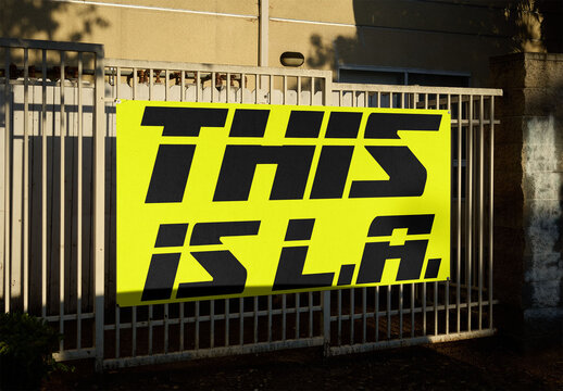 Real photo of  Sign on a Fence in Los Angeles. PSD mockup.