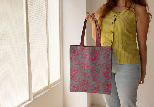 Real photo of Tote Bag is Held by woman. PSD Mockup.