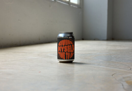 Real photo of Can Stands Alone on a Clean Floor. PSD mockup.