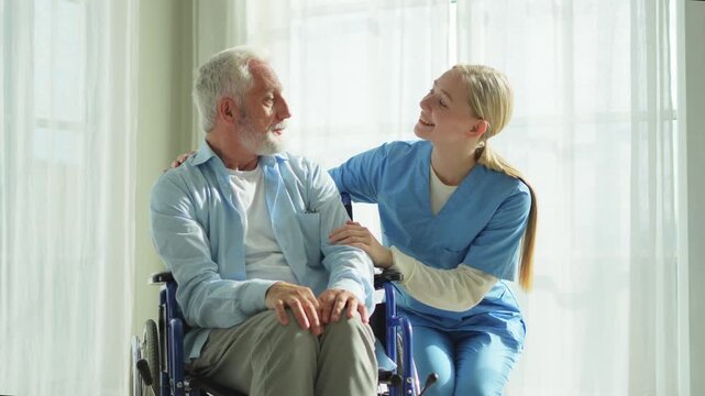Help support retirement healthcare. Nurse helping old man in wheelchair. Patient and woman in nursing home for medical caregiver. Nurse taking care of paralyzed man in chair for people with disability