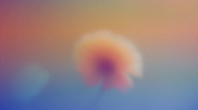 Abstract floral image with soft focus and gradient colors creating a dreamy atmosphere, featuring a blurred flower shape against a colorful background