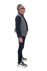 Naklejka premium side view of a modern retired man standing on white background