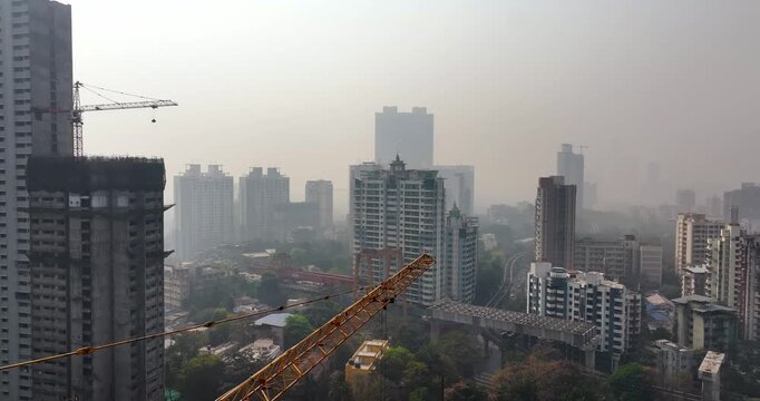 Aerial view of a building under construction in the middle of Mumbai city, India. The image captures urban development and high-rise construction activity.