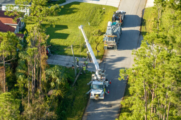 Electrical service company restoring power repairing damaged power lines after hurricane in Florida...