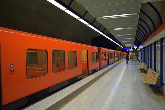 Classic orange HSL (Helsinki Regional Transport) train on a deserted platform at a metro station in Helsinki, Finland, 2015 