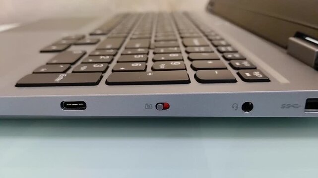 Modern connection interfaces on the side panel of a laptop, ports and security switch on a laptop