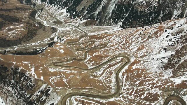 Aerial view of winding mountain road at Suyek Pass in Kyrgyzstan 