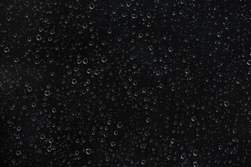 Obraz premium Raindrops on glass window isolated on transparent background. High-contrast water droplet texture for cinematic overlays, stormy weather effects, and atmospheric digital art backgrounds