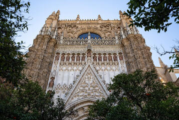Fototapeta premium Fragment of the architecture of the Seville Cathedral of Saint Mary of the See (Catedral de Santa Maria de la Sede). The northern facade
