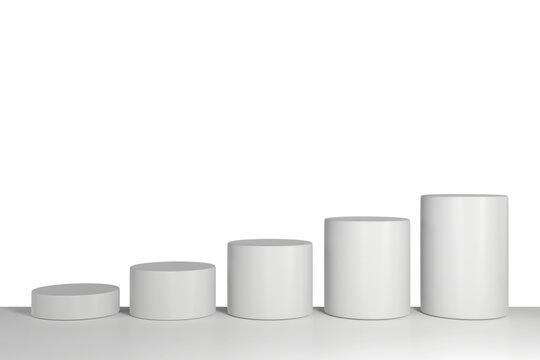 White cylindrical display podiums of varying heights on a plain background. 3d rendering