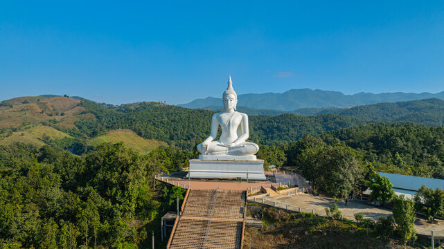 Wat Phra That Pu Jae is a historic mountain temple in Rong Kwang District, Phrae, recognized as a national archaeological site. The ancient square pagoda enshrines a sacred Buddhist relic 